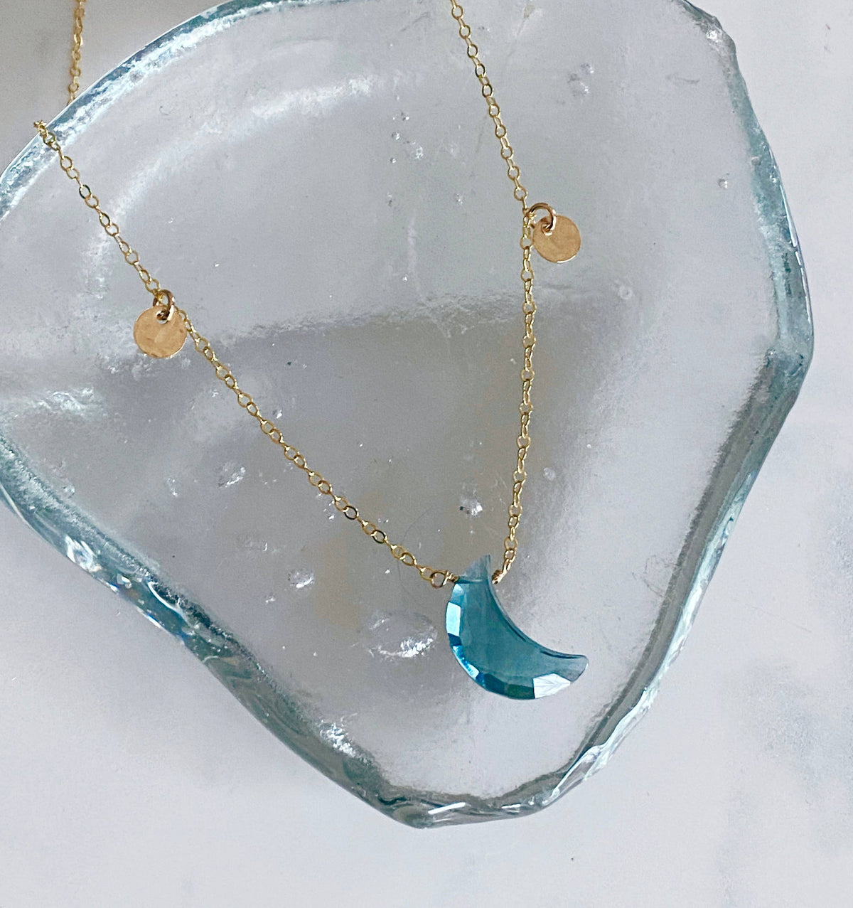 Blue topaz crescent necklace