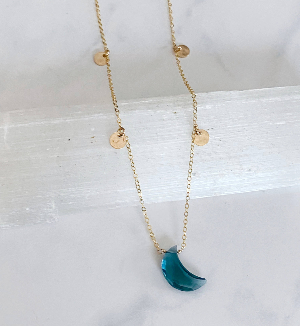 Blue topaz crescent necklace