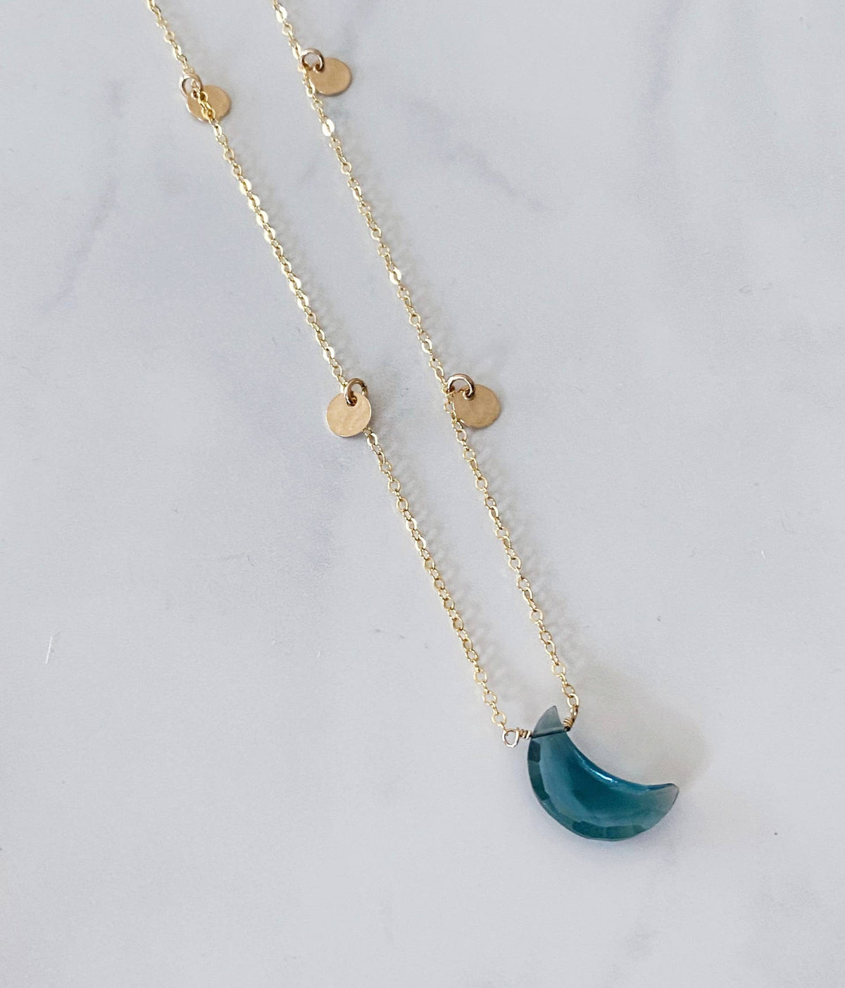 Blue topaz crescent necklace